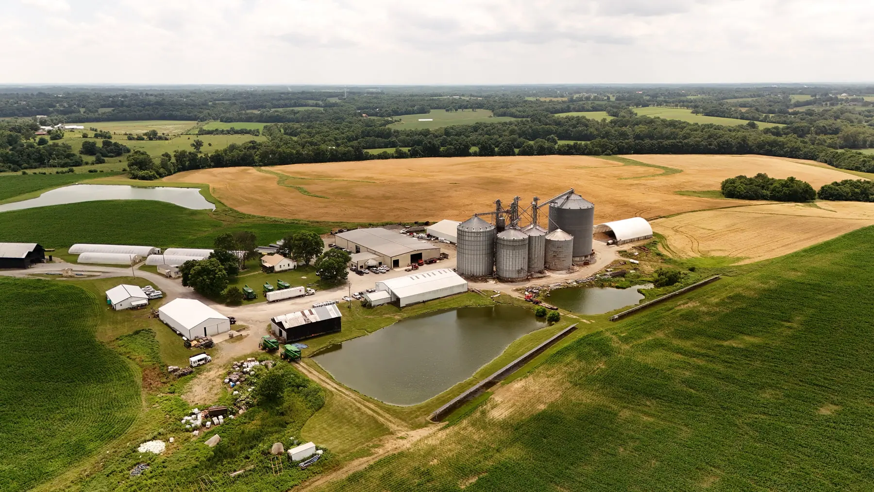 Aerial view of grain storage, pens and fields outside Shelbyville, Kentucky
